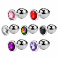 Round jeweled metal plug colour options: rose pink, red, clear, rainbow, black, deep purple and light purple. Sold individually.