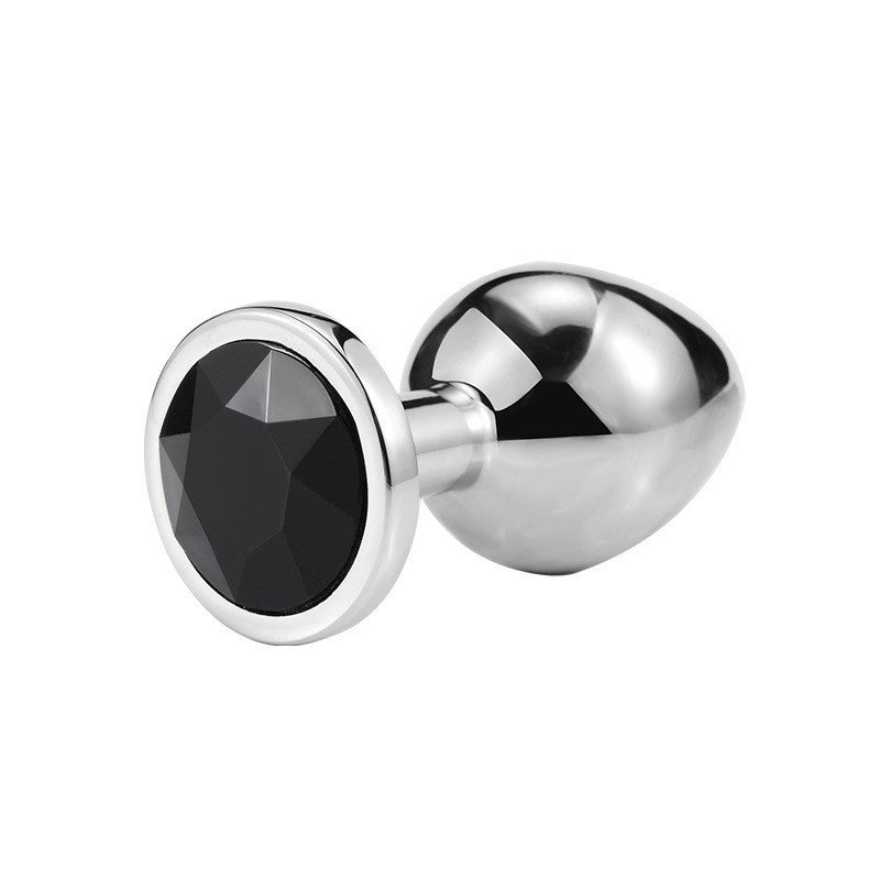 Round jeweled metal plug with black jewel