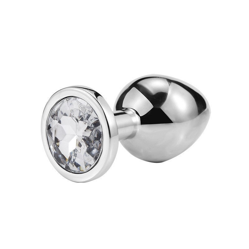 Round jeweled metal plug with clear jewel