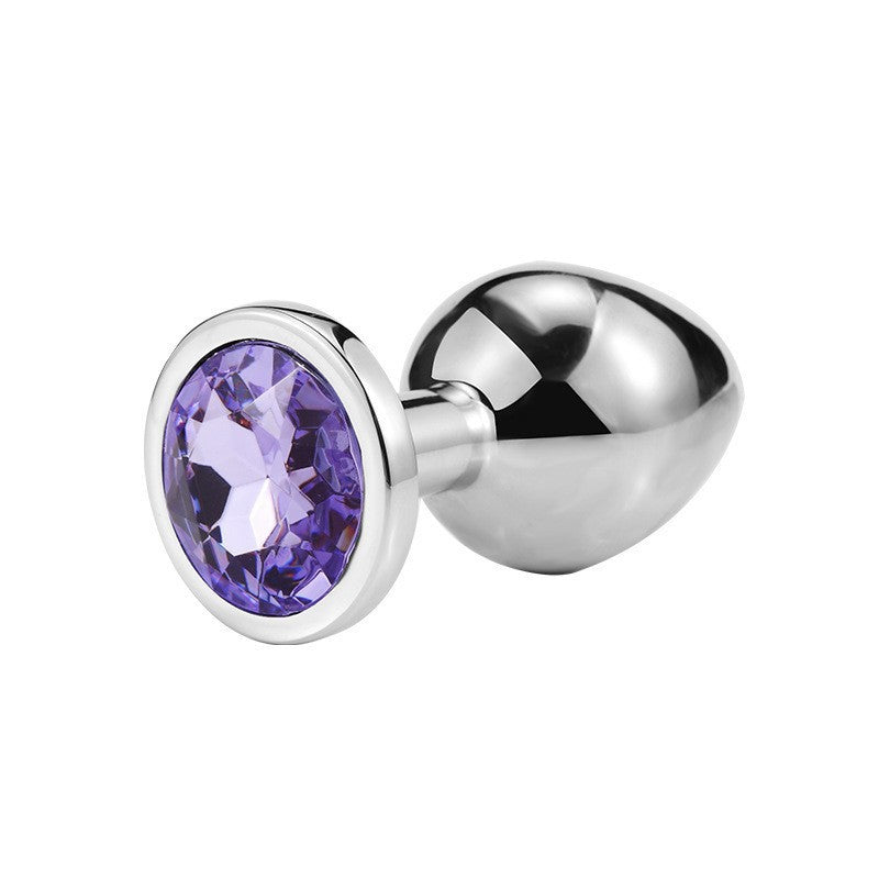 Round jeweled metal plug with light purple jewel