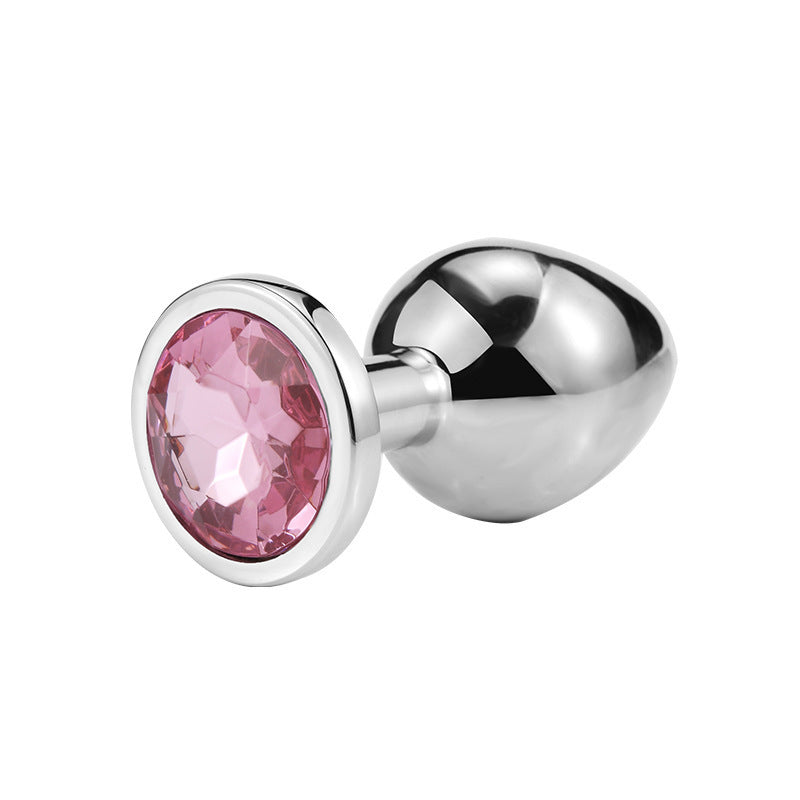 Round jeweled metal plug with rose pink jewel
